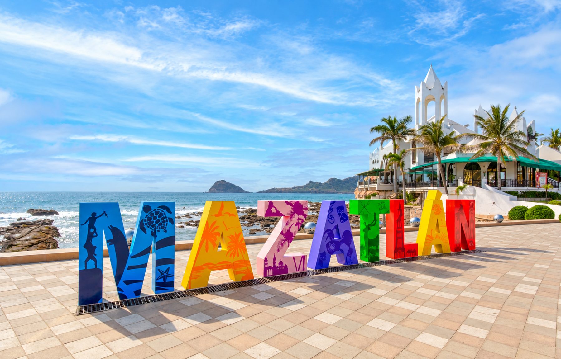 Colorful MAZATLÁN letters on the malecón, with the islands on the horizon